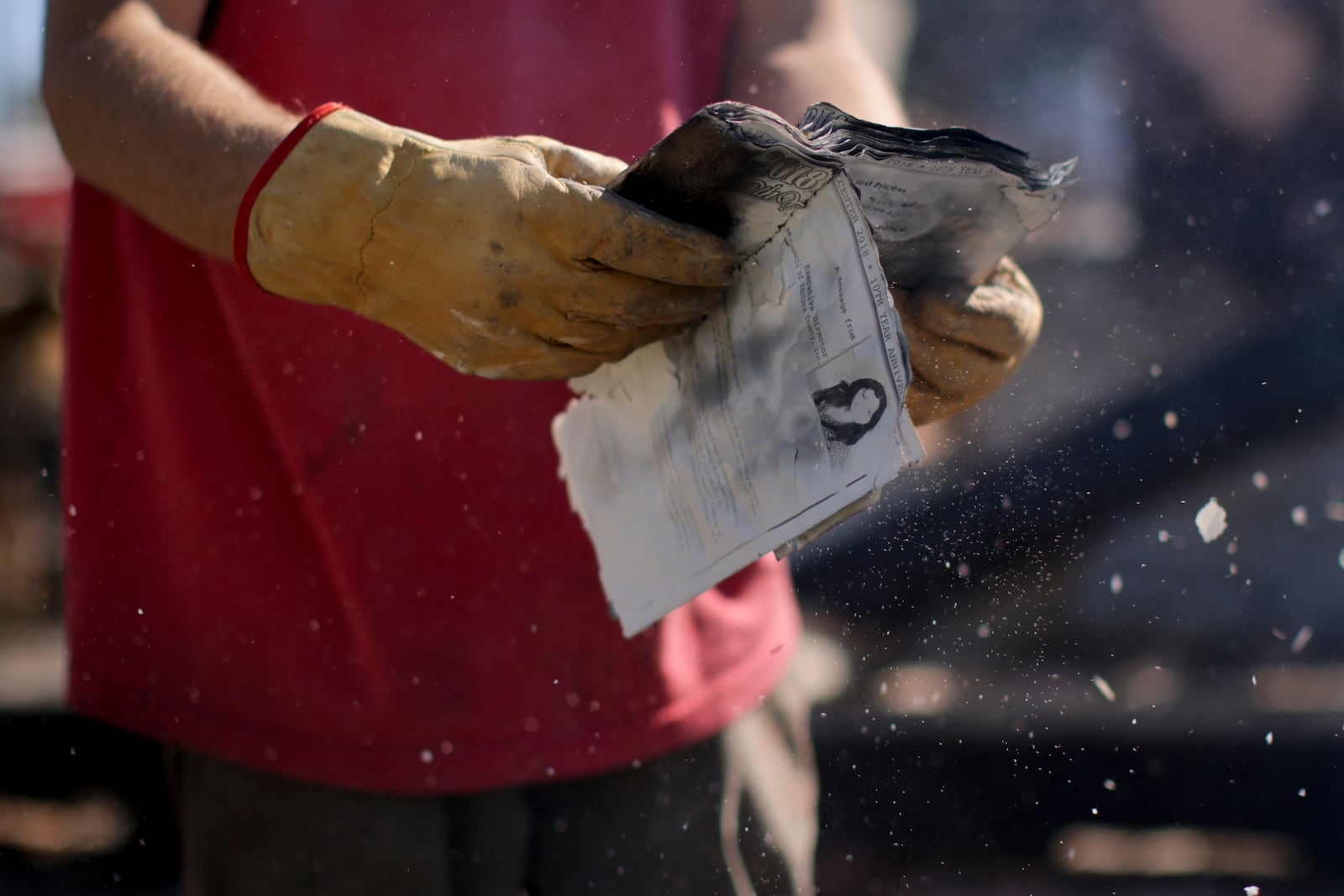 Todd Howard sifts through the remains of his parents' fire-ravaged property after the Mountain Fire swept through, Thursday, Nov. 7, 2024, in Camarillo, Calif. (AP Photo/Ethan Swope)