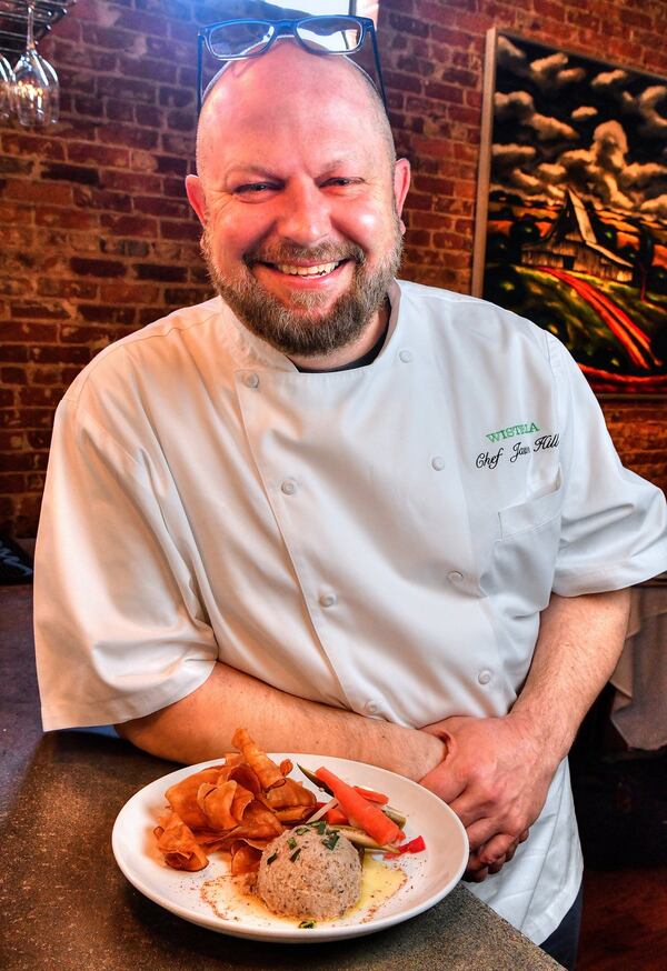 Wisteria chef and owner Jason Hill is proud of his Black-Eyed Pea Hummus & House Pickle Plate. STYLING BY JASON HILL / CONTRIBUTED BY CHRIS HUNT PHOTOGRAPHY