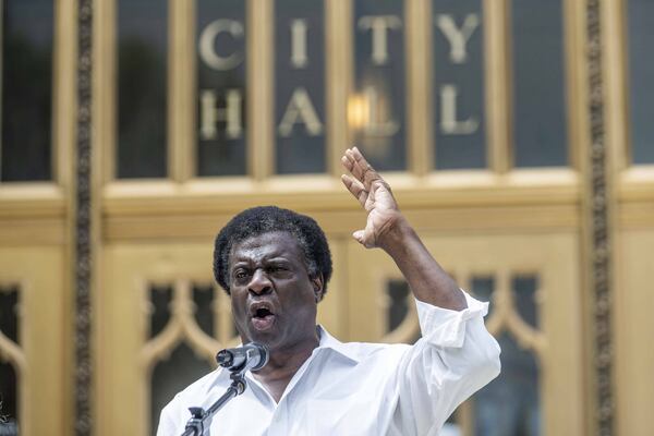 Afemo Omilami of Hosea Helps becomes emotional during a prayer vigil at Atlanta’s City Hall on Wednesday, July 8, 2020. The event honored Secoriea Turner, the 8-year-old girl who was shot and killed in southeast Atlanta during a wave of violence over the Fourth of July weekend. (ALYSSA POINTER / ALYSSA.POINTER@AJC.COM)