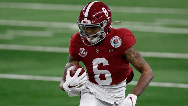 Alabama wide receiver DeVonta Smith (6) gains yardage after a catch in the first half of the Rose Bowl against Notre Dame Friday, Jan. 1, 2021, in Arlington, Texas. (Roger Steinman/AP)