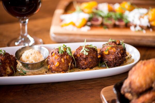 Corn and Crab Hushpuppies with citrus remoulade and honey-thyme butter. Photo credit- Mia Yakel.