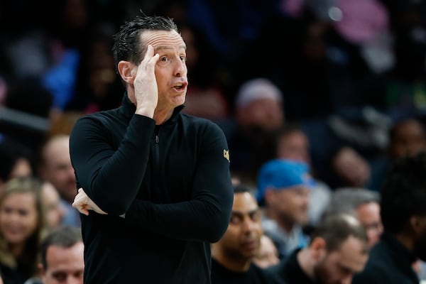 Cleveland Cavaliers head coach Kenny Atkinson calls a play during the first half of an NBA basketball game against the Charlotte Hornets in Charlotte, N.C., Friday, March 7, 2025. (AP Photo/Nell Redmond)