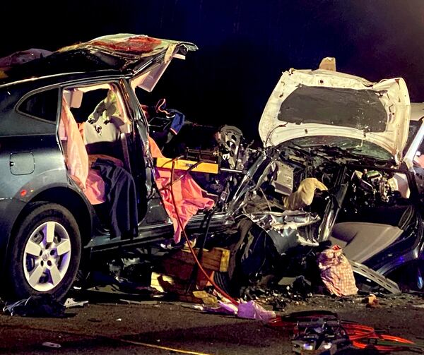 Wreckage from the scene of the fatal accident, which claimed the lives of six, is scattered on Interstate 95 near Savannah on Sunday morning.