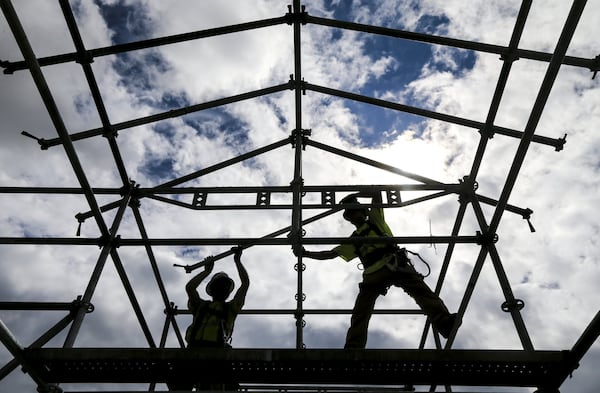 Construction of a temporary sidewalk covering at Hartsfield-Jackson. JOHN SPINK/JSPINK@AJC.COM File Photo