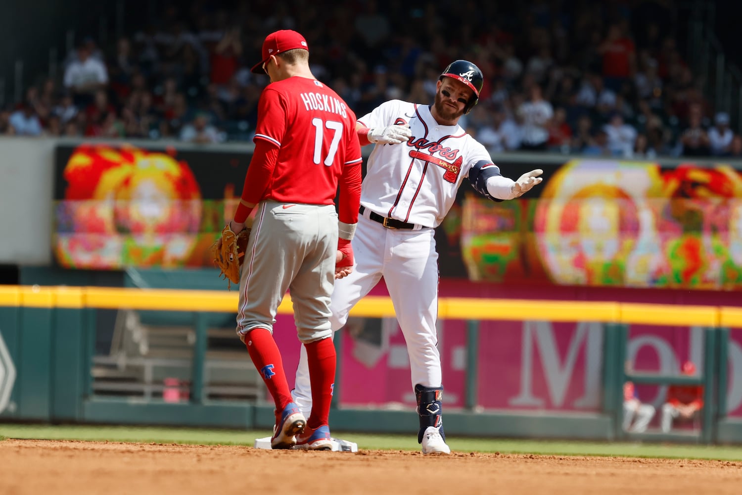 Braves outfielder Robbie Grossman reacts after hitting an RBI double during the third inning against the Phillies on Sunday at Truist Park. (Miguel Martinez / miguel.martinezjimenez@ajc.com) 