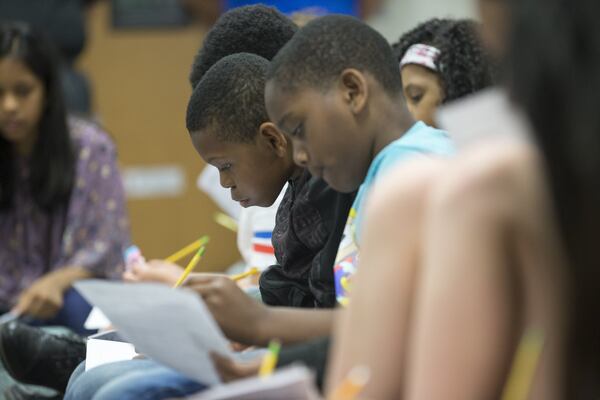 A fifth-grader at Mason Elementary answers questions after watching a short sci-fi film during the first Kids with STEAM Film Festival at the school in Duluth, on Thursday, May 4, 2018. Amanda Ray, founder and CEO of the Multicultural Sc-fi organization, hosted the Science, Technology, Engineering, Art and Mathematics film festival to encourage students to explore these fields for their future. ALYSSA POINTER/ALYSSA.POINTER@AJC.COM