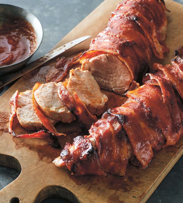 Bacon-Wrapped Barbecue Pork Tenderloin is among the recipes in "Betty Crocker Best 100.” Recipes have been adapted to modern standards. For instance, today's pork doesn't need to be cooked to as high a temperature to be safe. (Courtesy of General Mills)