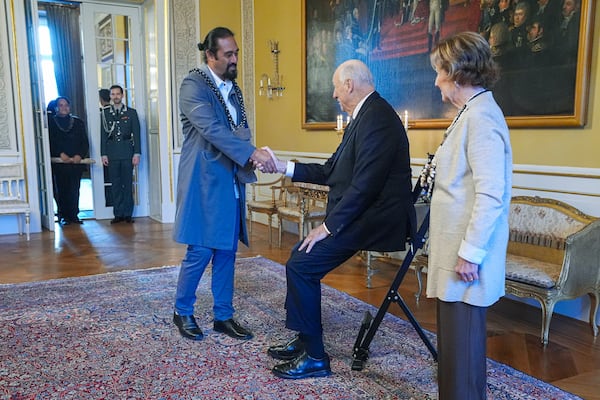 Norway's King Harald, centre, and Queen Sonja, right, welcome Miguel Pate Haoa, at the Royal Palace, in Oslo, Norway, Tuesday, Nov. 12, 2024. (Lise Aaserud/NTB Scanpix via AP)