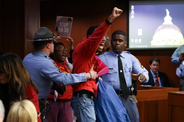 A protester yells,”Free, free Palestine” after the Senate Judiciary Committee passed an antisemitism bill Monday. Some protesters were removed from the room. (Jason Getz/jason.getz@ajc.com)