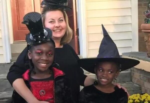 Caroline Brasler with her two adopted daughters in September.