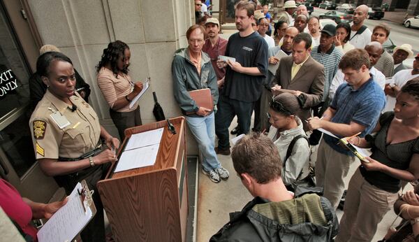 A crowd attended a 2009 foreclosure auction at the steps of the Fulton courthouse.