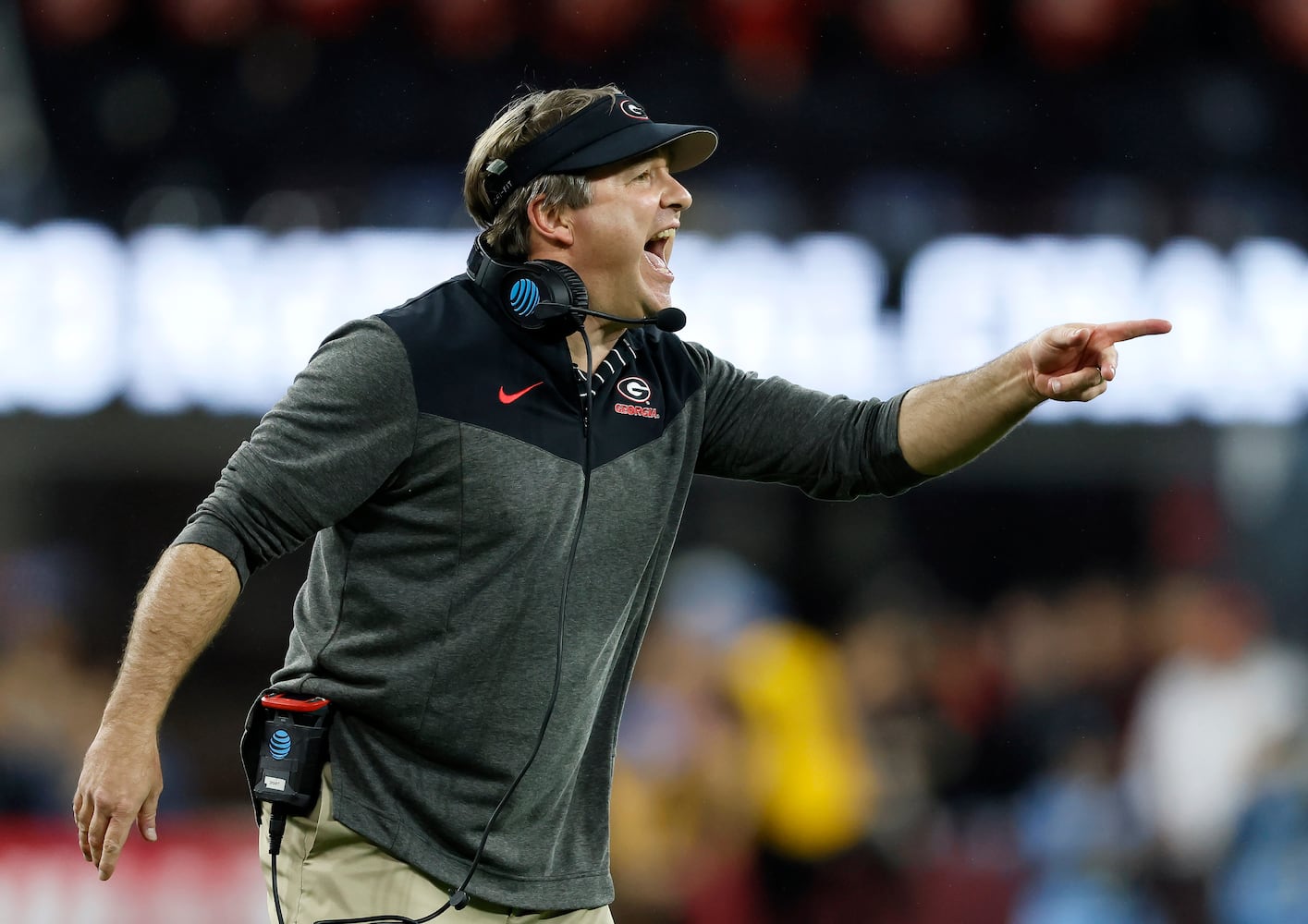 Georgia Bulldogs head coach Kirby Smart calls in a play against the TCU Horned Frogs during the second half of the College Football Playoff National Championship at SoFi Stadium in Los Angeles on Monday, January 9, 2023. Georgia won 65-7 and secured a back-to-back championship. (Jason Getz / Jason.Getz@ajc.com)