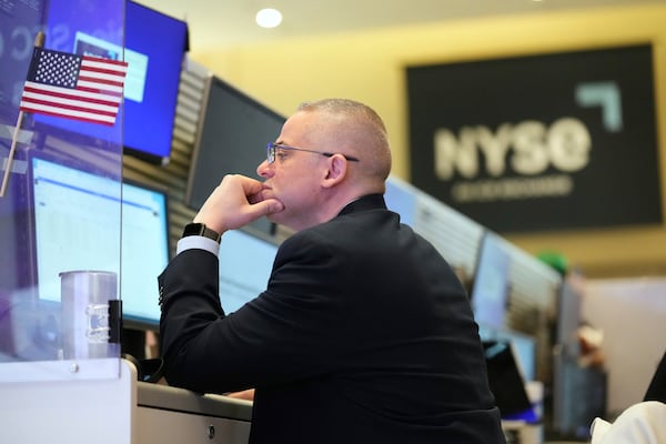 People work on the options floor at the New York Stock Exchange in New York, Tuesday, March 4, 2025. (AP Photo/Seth Wenig)