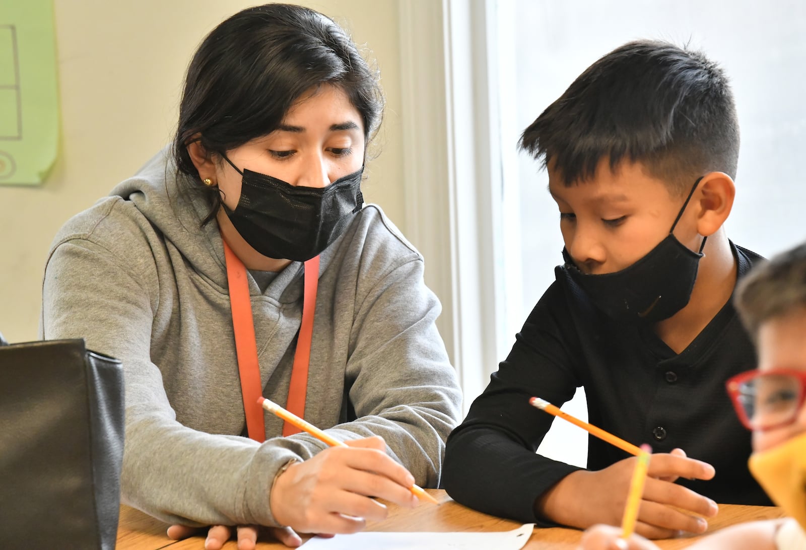 Andrea Castillo teaches her students during the after-school tutoring program at Corners Outreach in Norcross on Feb. 16. To address pandemic learning loss, Gwinnett County Public Schools will bring in Corners Outreach and more than 30 other tutoring providers to work with students who need additional help with school coming back from virtual learning. (Hyosub Shin / Hyosub.Shin@ajc.com)