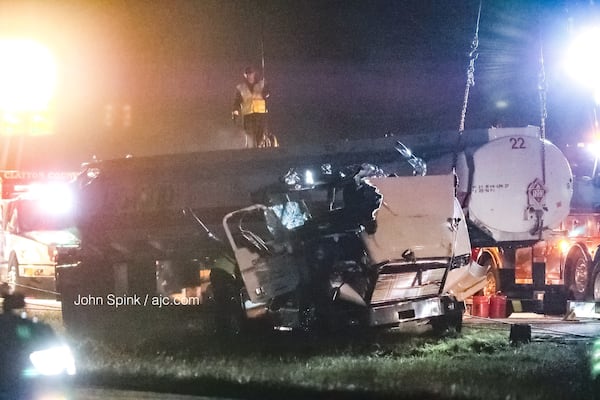 Several agencies responded to assist with cleanup efforts Tuesday morning after a tractor-trailer carrying gasoline overturned on I-675 in Clayton County, spilling fuel onto the interstate. JOHN SPINK / JSPINK@AJC.COM