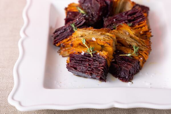 Three different colored potatoes bring vivid color and intrigue to this Tricolor Potato Pavé, a typically high-end chef dish made far easier with a few adjustments for home cooks. (Courtesy of Brooke Slezak)