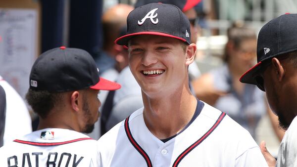 Mike Soroka is all smiles in the dugout after going 6 1/3 scoreless innings against the New York Mets on June 13, 2018, in Atlanta.  Curtis Compton/ccompton@ajc.com