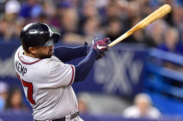 Braves left fielder Matt Kemp hits a two-run double during the ninth inning against the Toronto Blue Jays Tuesday. (Frank Gunn/The Canadian Press via AP)