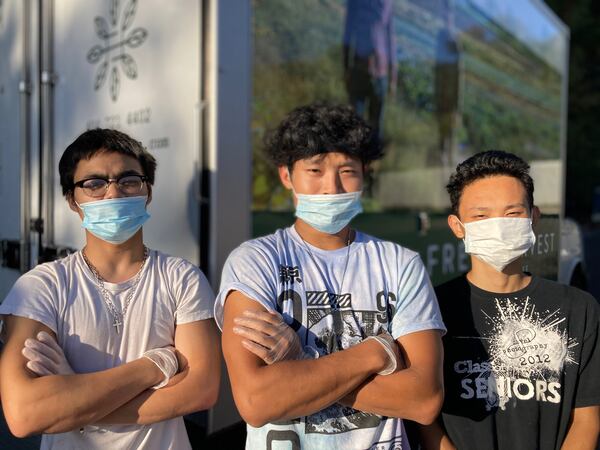 Refugees now comprise more than 60% of Fresh Harvest's 80-person payroll. Among them are, from left, Hay Hay, Hsa Eh and Hay Blu Moon, part of a crew that works overnight to prep trucks for the next day’s deliveries. Courtesy of Fresh Harvest