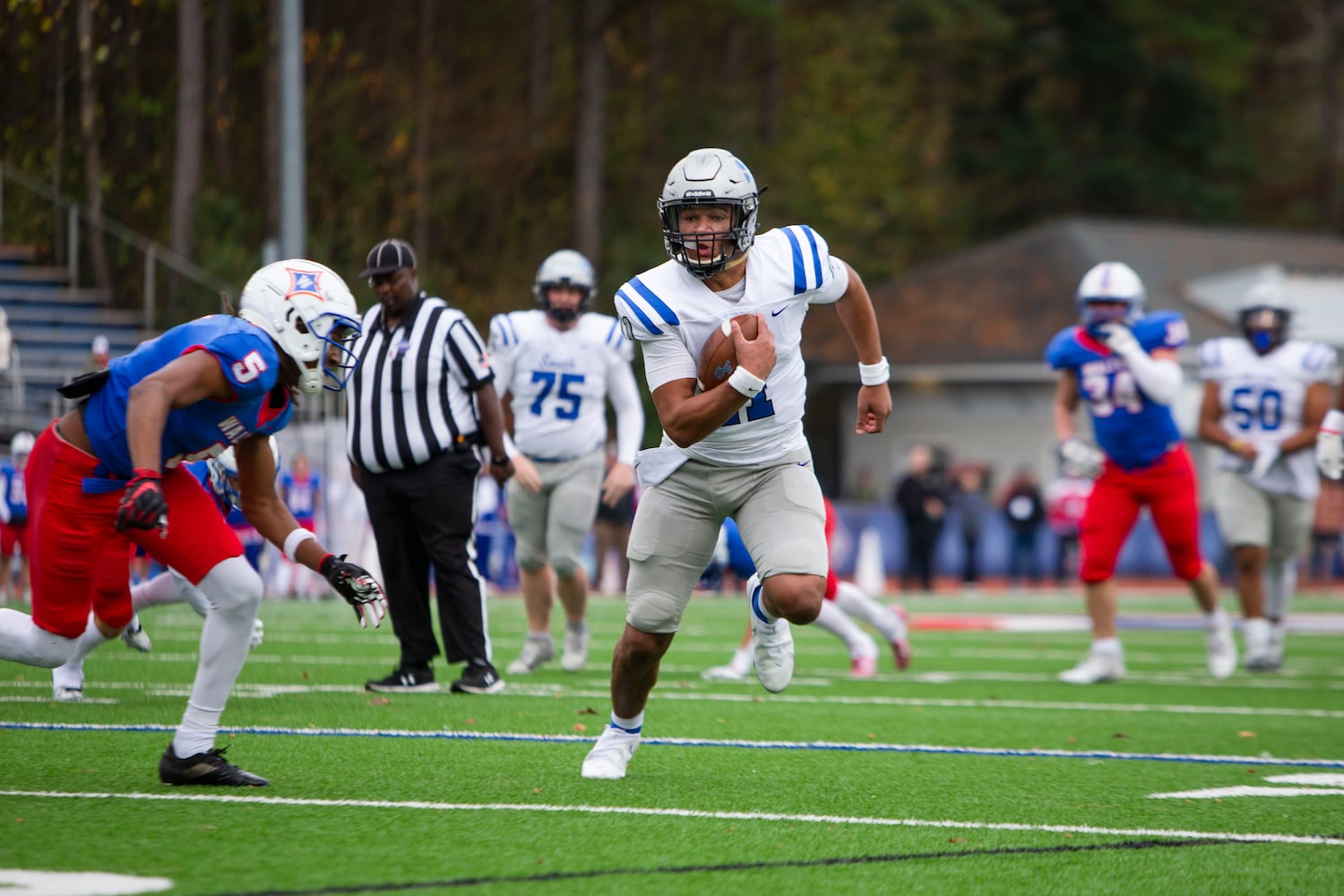 Ty Watkins, quarterback for South Forsyth, runs the ball. CHRISTINA MATACOTTA FOR THE ATLANTA JOURNAL-CONSTITUTION.