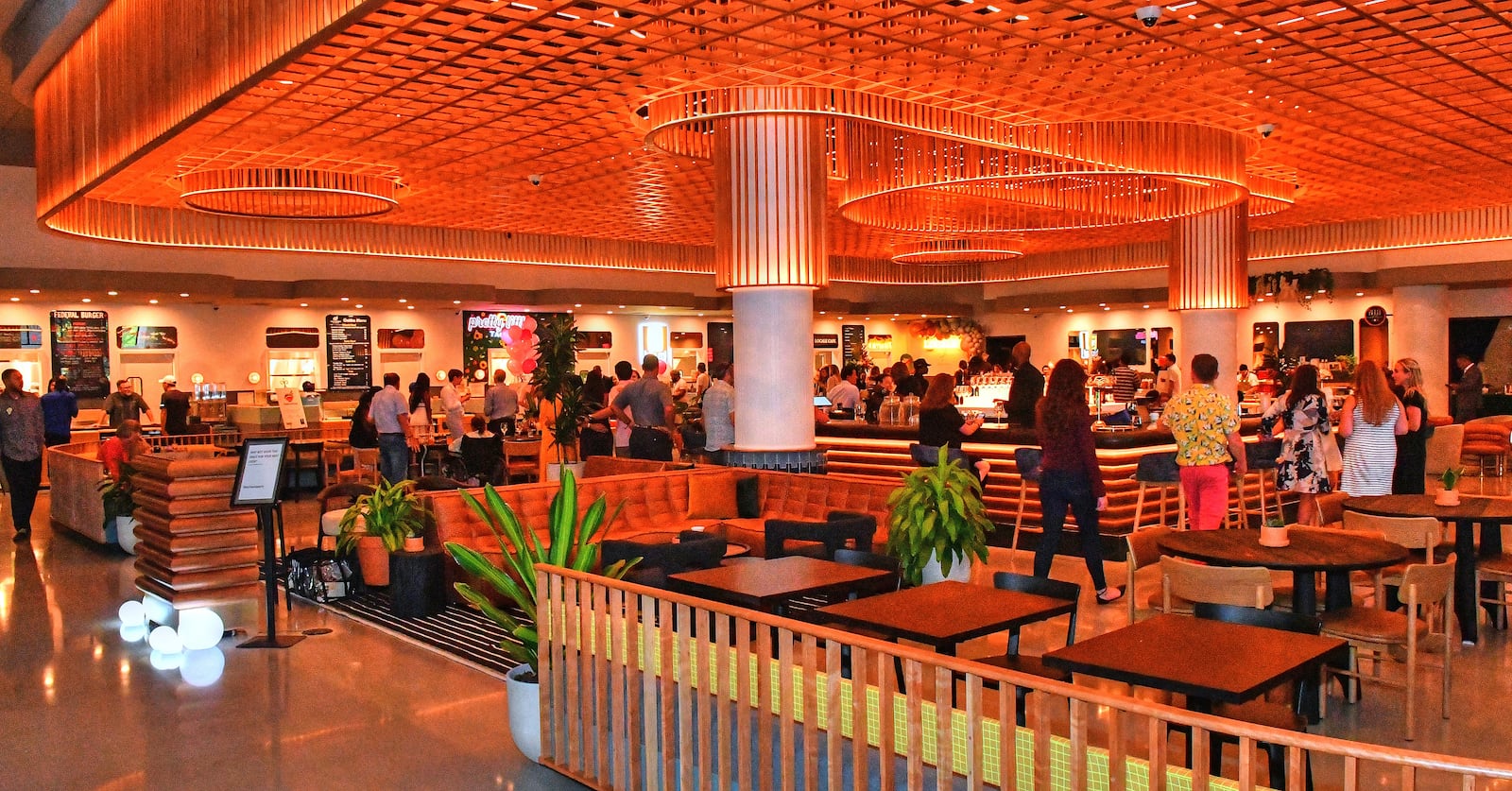 The new Politan Row food hall at Colony Square features a central full bar with surrounding unique food offerings and nontraditional "food court" soft seating. (Chris Hunt for The Atlanta Journal-Constitution)