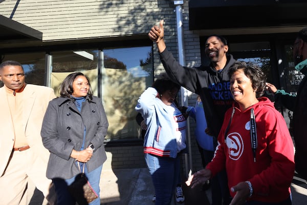 Outside Buzz Coffee and Winehouse on Cascade Road, Dickens waved to drivers who passed by and honked their horns in support. Miguel Martinez for The Atlanta Journal-Constitution 