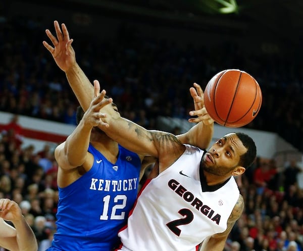 Georgia forward Marcus Thornton (2) and Kentucky forward Karl-Anthony Towns (12) battle for a rebound in the first half of an NCAA college basketball game Tuesday, March 3, 2015, in Athens, Ga. (AP Photo/John Bazemore) A third time for these two teams? (John Bazemore/AP photo)