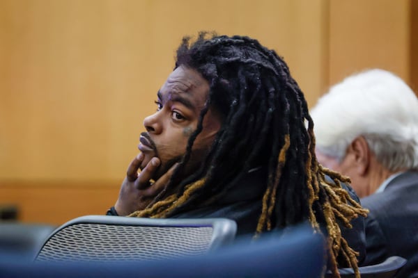 Defendant Shannon Stillwell looks at the prosecutors during the YSL trial at Fulton County Courthouse in Atlanta on Monday, Dec. 2, 2024. Stillwell was stabbed twice at the Fulton County jail. (Miguel Martinez/AJC)