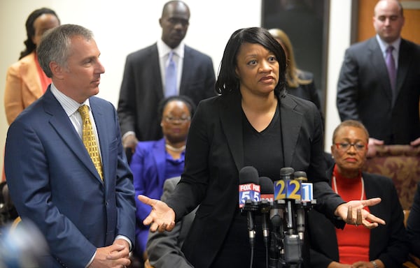 Former APS Dobbs Elementary principal Dana Evans and Bob Rubin (left), her defense attorney at trial, speak during a press conference at the Atlanta law offices of defense attorney George Lawson on April 17, 2015. (KENT D. JOHNSON / AJC file photo)