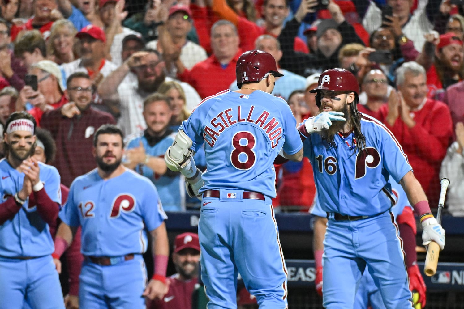 Philadelphia Phillies’ Nick Castellanos celebrates with Brandon Marsh (16) after a solo home run against the Atlanta Braves during the sixth inning of NLDS Game 4 at Citizens Bank Park in Philadelphia on Thursday, Oct. 12, 2023.   (Hyosub Shin / Hyosub.Shin@ajc.com)