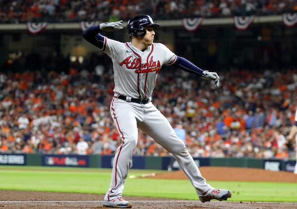 Braves first baseman Freddie Freeman celebrates with a chop going around third base after he hit a solo home run during the seventh inning against the Houston Astros in game 6 of the World Series at Minute Maid Park, Tuesday, November 2, 2021, in Houston, Tx. Curtis Compton / curtis.compton@ajc.com