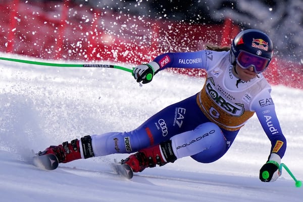 Italy's Sofia Goggia speeds down the course of an alpine ski, women's World Cup super G race, in La Thuile, Italy, Thursday, March 13, 2025. (AP Photo/Piermarco Tacca)