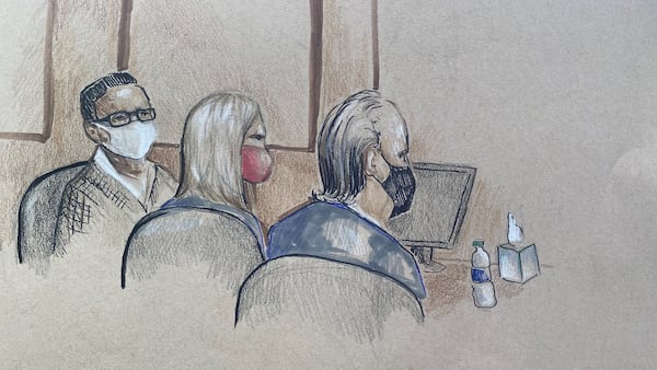 Mitzi Bickers (L) listens in U.S. District Court in Atlanta on the Wednesday, March 9, 2022, during the first day of jury selection in her public corruption trial. Seated beside her are defense attorneys Marissa Goldberg and Drew Findling. Credit: Artist Lucy Luckovich.