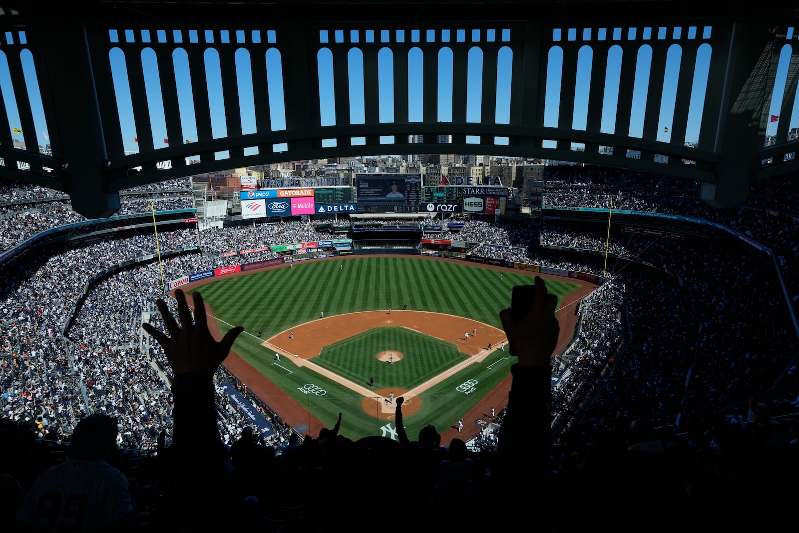 FILE - Fans react after New York Yankees' Aaron Judge hits a home run during the third inning of a baseball game against the San Francisco Giants at Yankee Stadium, Sunday, April 2, 2023, in New York. (AP Photo/Seth Wenig, File)