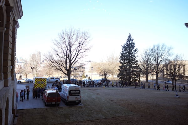 Protesters line up at the Iowa state Capitol in Des Moines to denounce a bill that would strip the state civil rights code of protections based on gender identity, Thursday, Feb. 27, 2025, in Des Moines, Iowa. (AP Photo/Charlie Neibergall)