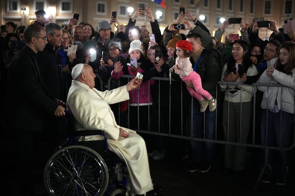 Pope Francis waves faithfuls after celebrating over New Year's Eve Vespers and Te Deum, in St.Peter's Square at the Vatican, Tuesday, Dec. 31, 2024. (AP Photo/Andrew Medichini)