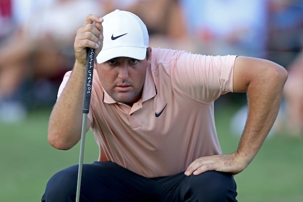 Scottie Scheffler prepares to putt on the eighteenth fairway during the second round of the Tour Championship at East Lake Golf Club, Friday, August 26, 2022, in Atlanta. (Jason Getz / Jason.Getz@ajc.com)