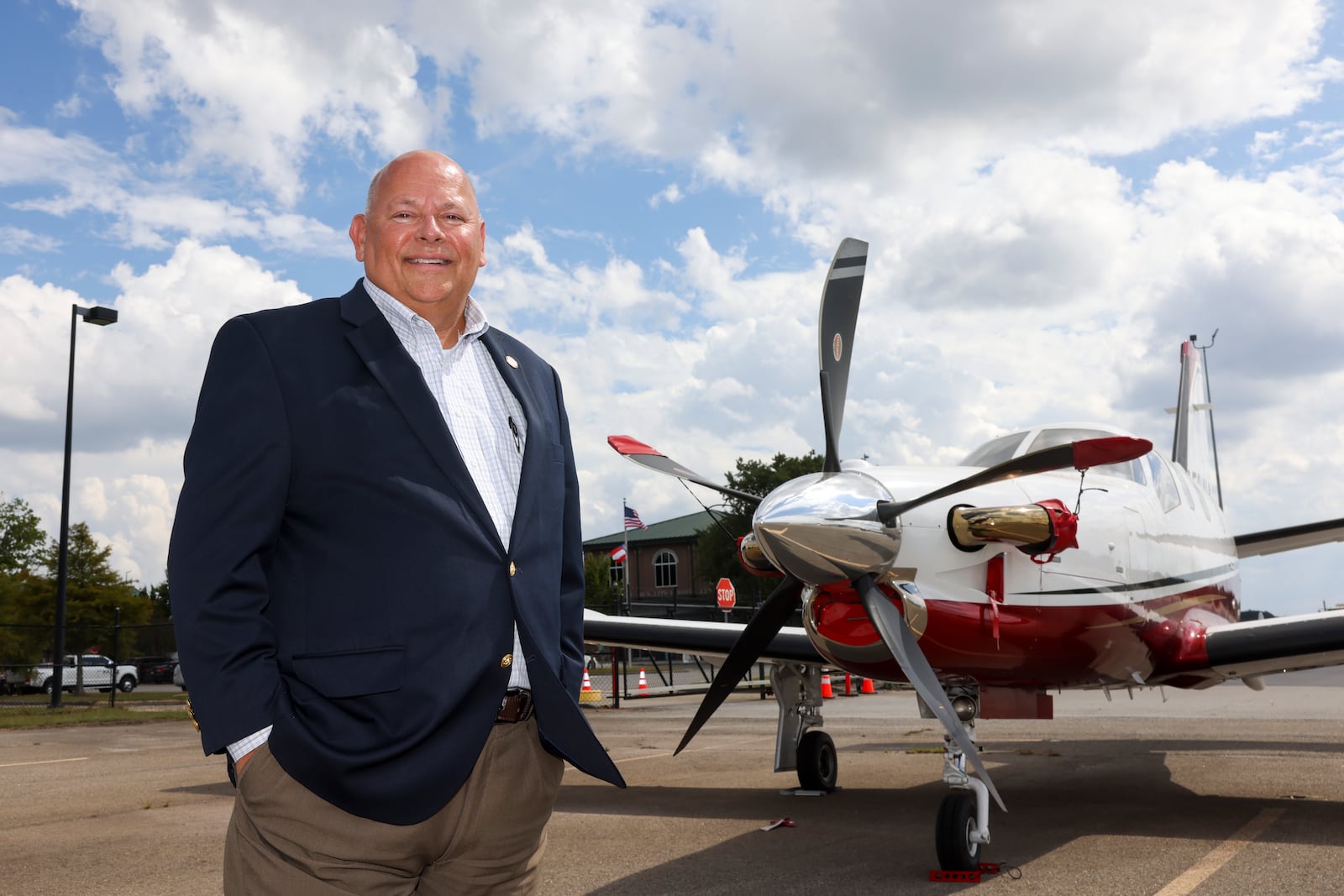 Mike Mathews, airport director, is shown next to a single-propeller plane at the Athens Ben Epps Airport, Wednesday, Sept. 25, 2024. The facility is a county-owned, public-use airport that has seen a boom in recent years due in part to the success of Georgia's football team. (Jason Getz / AJC)

