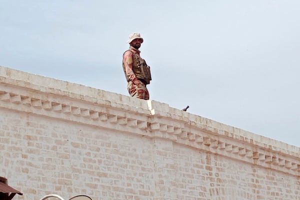 A paramilitary soldier takes position at a railway station near the attack site of a passenger train by insurgents, in Mushkaf in Bolan district of Pakistan's southwestern Balochistan province, Wednesday, March 12, 2025. (AP Photo)