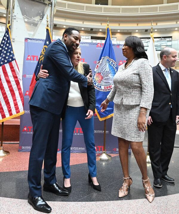 Atlanta Mayor Andre Dickens embraces Georgia first lady Marty Kemp at an event Tuesday targeting human trafficking. “We must remain steadfast and committed to working alongside each other,” Kemp said. “And if I remember correctly, the mayor so proudly said last year that he considered us friends. So I knew then we would have a great partnership working together.” AJC/Hyosub Shin