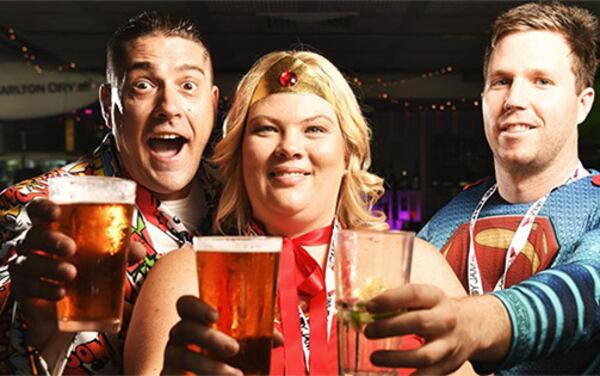 Everyday super heroes make a toast at the Super Hero Pub Crawl.