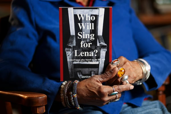 A detail of Janice Liddell holding her play she wrote about Lena Baker titled, “Who Will Sing for Lena?,” at Liddell’s home, Tuesday, February, 25, 2025, in Atlanta.  (Jason Getz / AJC)