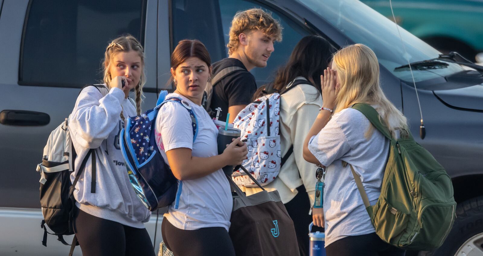 As students arrived at Apalachee High School on Tuesday morning, Sept. 24, 2024, the scene looked like a typical school day. Cars and buses circled through the car pool drop-off. Students carrying backpacks made their way from the parking lot to class. But Tuesday was the first day of classes at the Barrow County school since a shooting at the school killed four. (John Spink/AJC)