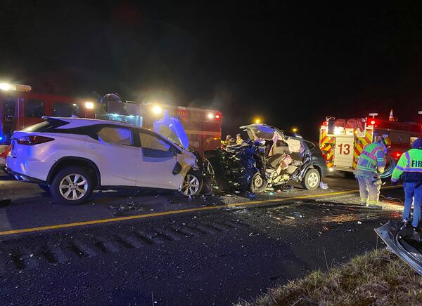 First responders from the Midway Fire Department survey the scene of a fatal accident on Interstate 95.