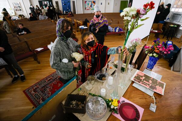 Forest defenders set up flowers at the altar for Manuel Terán ‘tortuuita’ during the Memorial Day of healing at Park Avenue Baptist Church on Thursday, January 18, 2024.
Miguel Martinez /miguel.martinezjimenez@ajc.com