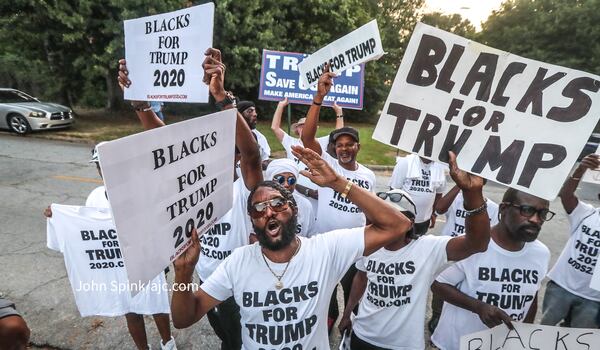 Groups of Trump supporters wait outside the Fulton County Jail on Thursday ahead of the former president's surrender. (John Spink / John.Spink@ajc.com )