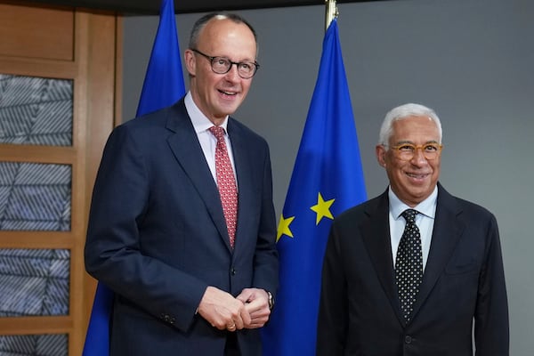 European Council President Antonio Costa, right, greets Friedrich Merz, leader of the Christian Democratic Union, prior to a meeting at the European Council building in Brussels, Thursday, March 6, 2025. (AP Photo/Virginia Mayo)