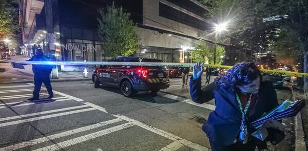 A shooting Monday morning, April 4, 2020 left a man dead on the sidewalk outside a luxury apartment building in Midtown Atlanta. As of April 14, 2022, APD had investigated 51 homicides since Jan. 1, up from 39 this time last year.  (John Spink / John.Spink@ajc.com)

