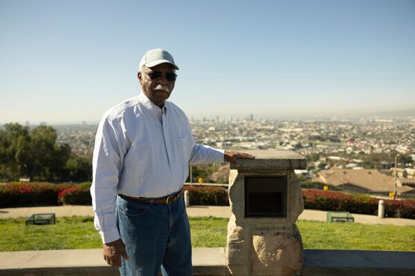 Theral Golden, who's lived in the West Long Beach area for more than 50 years, poses at Hilltop Park overlooking the Ports of Long Beach and Los Angeles, Monday, March 10, 2025, in Signal Hill, Calif. (AP Photo/Etienne Laurent)