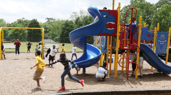 Children play on the playground at Dobbs Elementary School in Atlanta on Wednesday, May 1, 2019. Research has shown that a decline in unstructured “independent” play has made children more anxious and depressed.  (AJC File)